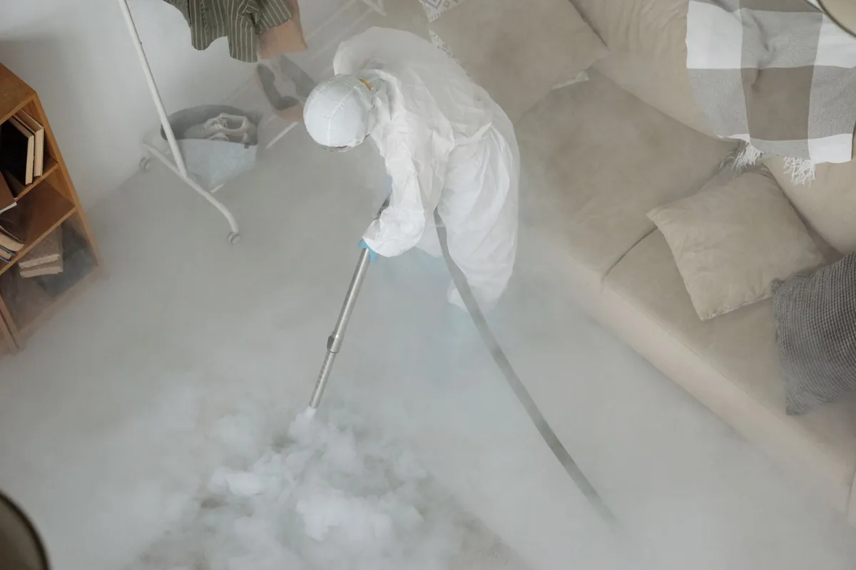 Biohazard cleanup technician in protective equipment, Midway, UT